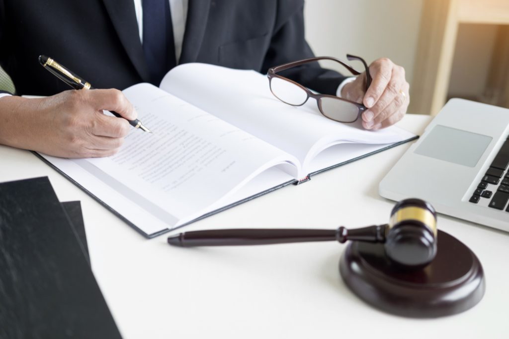 Lawyer hand writes the document in court