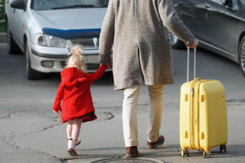 Man with girl in red