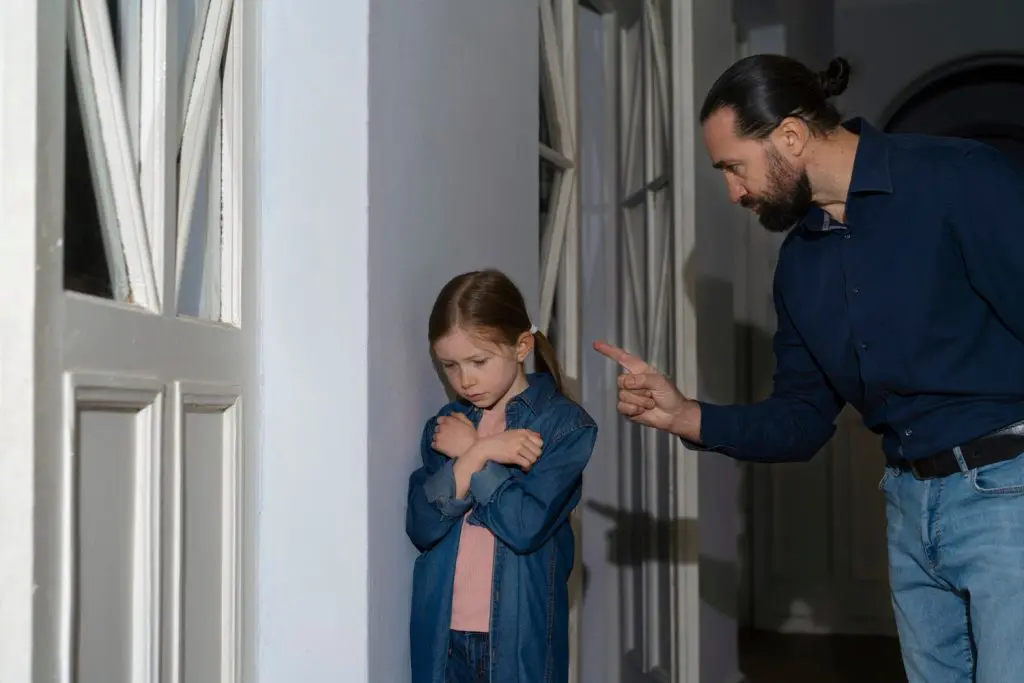 Young child receiving emotional abuse from parent